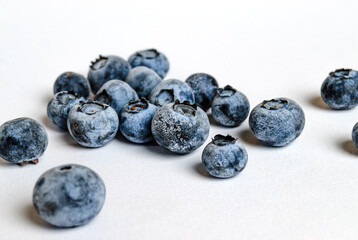 a lot of blueberries on a white background