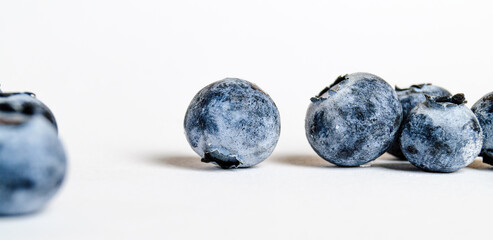 a lot of blueberries on a white background