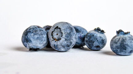 a lot of blueberries on a white background