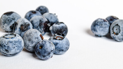a lot of blueberries on a white background