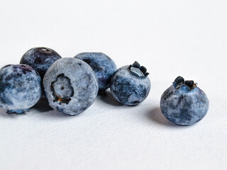 a lot of blueberries on a white background
