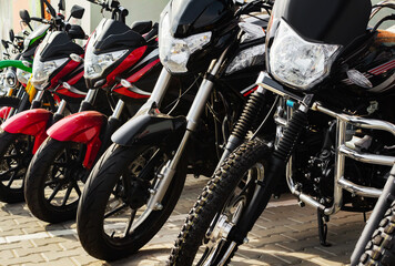 Fototapeta na wymiar Photo of new motorcycle vehicles standing on store parking.
