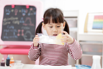 young girl playing Science experiment toys for homeschooling