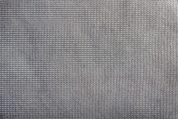 Fototapeta na wymiar Synthetic grey colored cloth texture.
