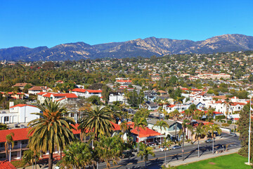 Aerial view of Santa Barbara historic city center with Santa Ynez Mountains at the background, from top of the clock tower of Santa Barbara County Courthouse, California CA, USA.  - obrazy, fototapety, plakaty