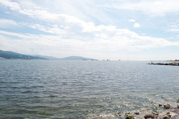 landscape with sea and mountains. view of the bay of the port city. ships on the roadstead on the...