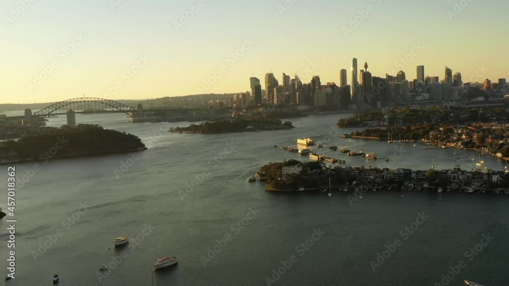 Poster panning in city of sydney over inner city suburbs and harbour – aerial 4k.