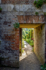 Doorway in Hill Gardens, Hampstead Heath, on a sunny summer afternoon, London, England