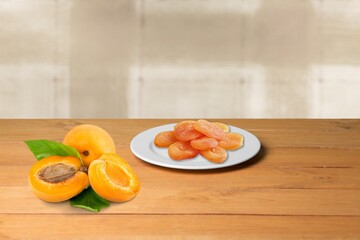 Tasty ripe apricots fruits on table