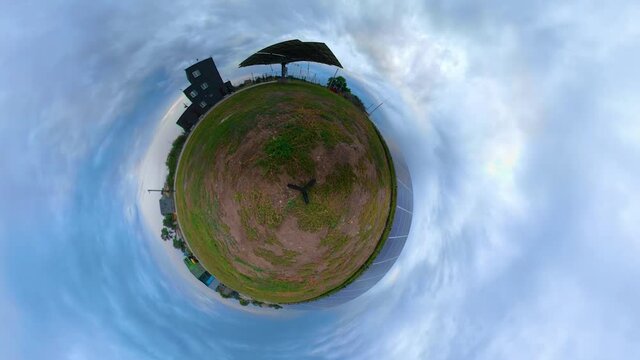 Little planet with a solar panel spinning around facing the sun