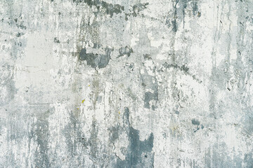 Rough plastered concrete wall with cracks. Dirty damaged texture, peeling plaster. Vintage background