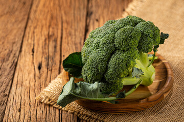 Green organic broccoli on the table.