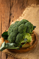 Green organic broccoli on the table.