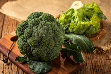 Green organic broccoli on the table.