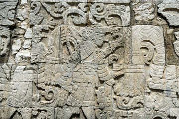 Fototapeta na wymiar Ancient stone wall in Chichen Itza, Mexico