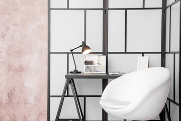 Stylish workplace with folding screen