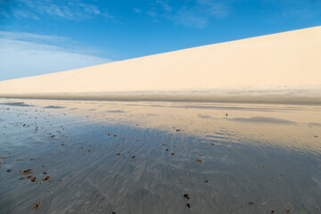 Reflections on the water. Brazilian beach located in Jericoacoara, Ceara.