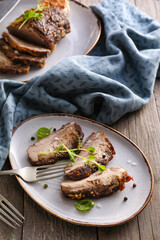 Plate with tasty beef brisket on table