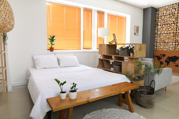 Interior of stylish room with comfortable bed