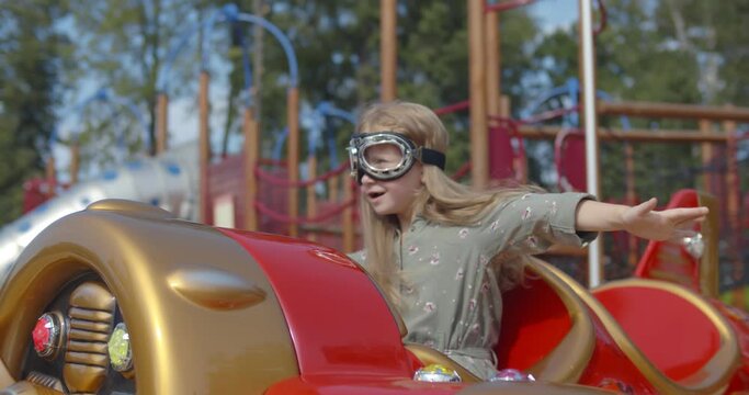 Happy caucasian child playing in park with spring rocker