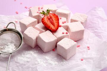 Tasty sweet marshmallows and strawberry on color background