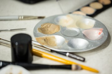 Closeup of Makeup Brushes and Palette