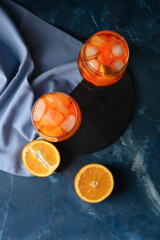 Composition with tasty aperol spritz cocktail on color background