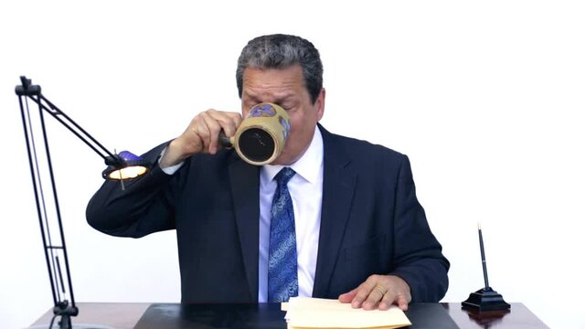 Businessman Laughing Hysterically And Spitting Coffee