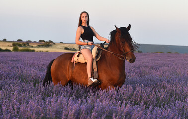 a caucasian blonde model in a pretty lavender field in spain