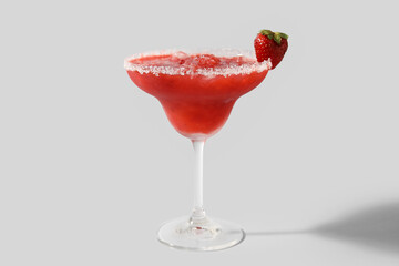 Glass of tasty strawberry margarita on white background