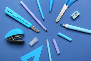 Stationery supplies on color background