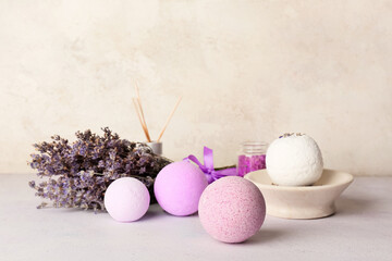 Composition with lavender bath bombs and flowers on light background