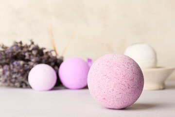 Naklejka na ściany i meble Composition with lavender bath bombs and flowers on light background