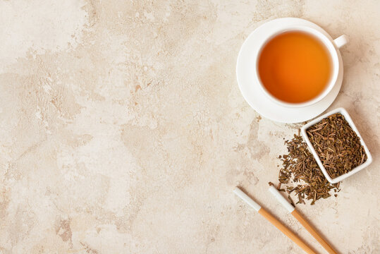 Composition with dry hojicha green tea on light background