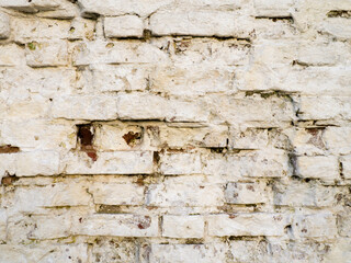 White brick wall. Old crumbling wall