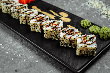 California Roll sushi with smoked eel, cucumber, avocado. Sushi menu. Japanese food