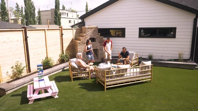 Multigenerational Family On Sunny Summer Patio