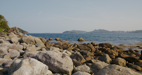 Fototapeta na wymiar Rock Stone sand beach in Lantau island