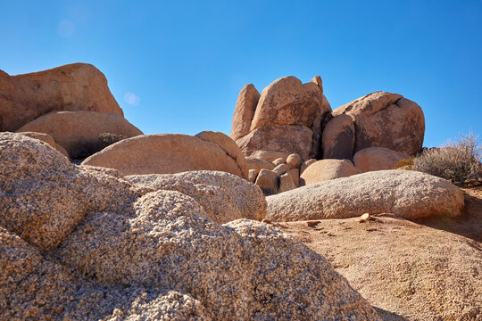 Rocks from an earthquake forming beautiful rock and boulder formations on a sunny day against a bright blue sky