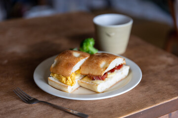 Home made focaccia hot sub with bacon and egg