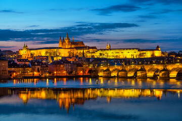 View of Prague Castle with the Palace of the President of the Czech Republic and the Gothic Cathedral from the Vltava River on a spring evening