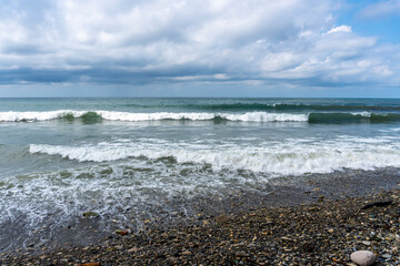 Fototapeta na wymiar small storm on the sea, waves hitting the shore