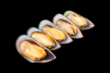 5 fresh peeled New Zealand mussels arranged isolated on a black background. popular seafood. Large...