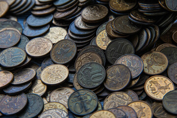 Ten-kopeck coins are scattered on the table. Scattered coins.