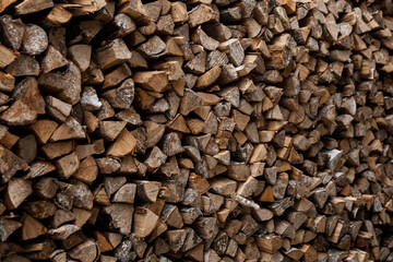 Woodpile with firewood. Close-up. Procurement of fuel for the winter in the village.