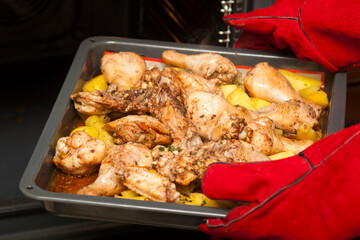 Cooking chicken meat with potatoes in the oven
