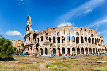 Tourists at the walls of the ancient Colosseum in Rome. Italy