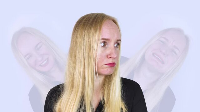 Conceptual photo. Woman is experiencing an attack of schizophrenia, it seems to him that there is someone nearby. Split personality. Psychiatry. Person experiences several emotions at the same time.