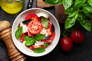 Caprese salad with fresh tomatoes, garden basil and mozzarella cheese