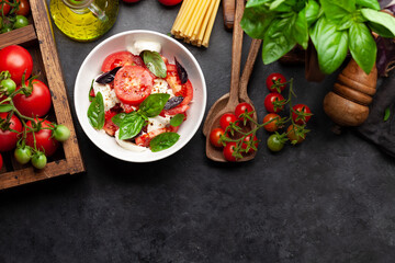 Caprese salad with fresh tomatoes, garden basil and mozzarella cheese